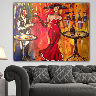 Painting of a woman in a red gown and black hat at a cocktail bar, hung above a dark grey sofa
